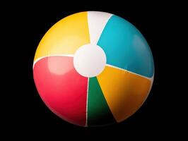 Colorful beach ball resting against a black background photo