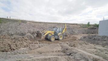 Excavation tractor works, compaction of the soil video