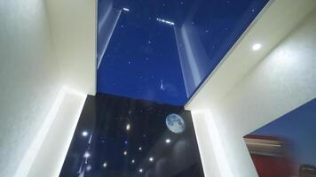 Installation of stretch ceilings with a print repeating starry sky video
