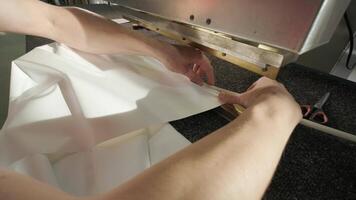Worker Adjusting Flexible Ceiling Sheet on Assembly Table video