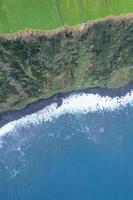 aerial top down drone image of a cliff on the north coast of the island of Sao Miguel. Azores photo