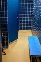 locker room design benches and hooks for swimmers in a public swimming pool installation photo