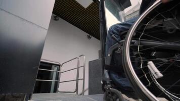 Special elevator for the person with a physical disabilities. A man in a wheelchair uses a special elevator video