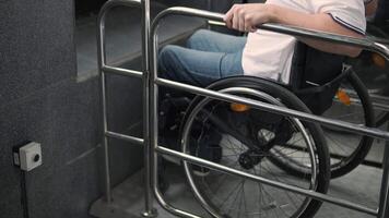 Special elevator for the person with a physical disabilities. A man in a wheelchair uses a special elevator 22 video