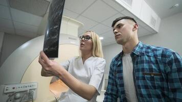 Radiologist Discussing Scan Results with Male Patient video
