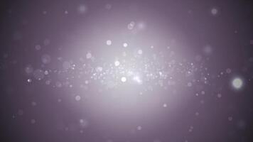 Purple background with many white bokeh circles suitable for festive designs, party invitations, abstract backgrounds, and dreamy concepts. video