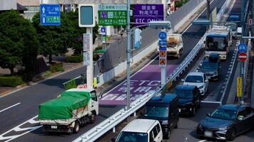 A timelapse of traffic jam at the doorway of the highway in Tokyo panning video