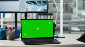 Green screen laptop in photovoltaics facility used for analyzing and reviewing system metrics. Chroma key device overseeing solar panels plant, troubleshooting technical issues video
