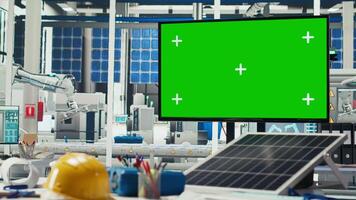 Chroma key monitor in empty photovoltaics factory used to diagnose malfunctioning systems. Isolated screen display in solar panels plant used for alerting in case of downtime video