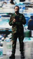 Vertical Soldier operates in a virtual war zone using digital technology and threat detection tools, showcasing modern military strategy. Ensuring secure communications in active operations. Camera B. video