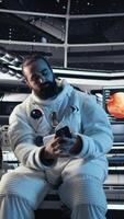Vertical Researchers flying together in starship, looking at green screen monitor, exploring Mars. Cosmonauts using mockup display to ensure operational readiness before landing on red planet, camera A video