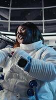 Vertical Team of cosmonauts calibrating starship sensors using isolated screen monitor, preparing for mission. Astronauts using chroma key display, beginning landing procedures on solar system planet, camera A video