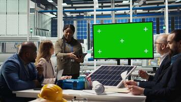 Researchers analyze solar cell prototypes to optimize energy production, looking at isolated screen monitor. Solar panels experts developing innovative manufacturing tech using chroma key display video
