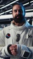 Vertical Astronaut monitoring life support systems before stepping out for scheduled operations outside space station. Cosmonaut verifying mission parameters after landing on red planet, camera A video