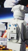 Vertical Curious astronaut standing on a distant planet in space suit and helmet, collecting samples beneath the sky filled with stars. Exploring alien worlds and cosmic frontiers in a space craft. Camera B. video