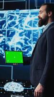 Vertical Surrounded by modern AI brain animation, entrepreneur explores virtual intelligence with green screen on device. Using automation platforms for a new innovative IT strategy. Camera B. video