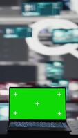 Vertical Empty scene with green screen on laptop showcases quantum threat on the dark web, space for a cyber crime with system override and identity theft. Cracking passwords to steal data. Camera B. video