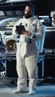 Vertical Extreme close up of astronaut exploring planetary surfaces talking with command center during videocall. Cosmonaut gathering stellar data provides scientific findings to Earth team, camera A video