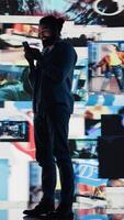Vertical Young addicted guy obsessing over social media presence at all times, isolation in the real world and anxiety building up. Obsessive dangerous doomscrolling and overuse. Camera B. video