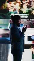 Vertical Smartphone user addicted by social media content consumption and obsessive doomscrolling that can trigger anxiety and harmful self esteem issues in the digital world. Overuse isolation. Camera B. video