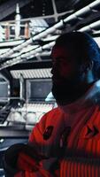 Vertical Astronaut checking human expansion in space mission data on laptop during cosmic journey. Orbit station crew managing systems using notebook during mankind survival expedition, camera A video