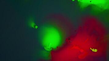 Red and Green Paint Bubbles explode. Multicolor Neon Ink Splatter Spreading from the Center. Acid Trippy Fluid art Painting. Vibrant Liquid Paint Backdrop video
