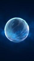 Glowing translucent blue sphere floating in deep dark space with ethereal lighting and smoke-like textures around it video
