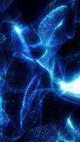 Swirling and morphing digital mesh made of glowing blue and green dots forming abstract three-dimensional surfaces on black background video