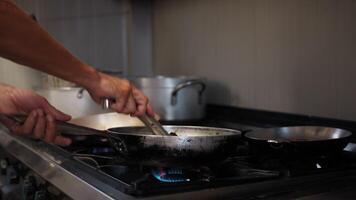 Chef Using Tongs Cooking Spaghetti With Mussels In The Pan video
