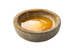 Melted beeswax in a stone bowl isolated on a transparent background png