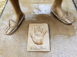 Kumamoto, Japan November 17, 2023 Handprint of Oda on the base of Luffy statue in front of Kumamoto Prefectural Government Building. photo