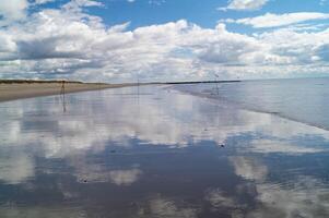 Cloud reflection on the North Sea photo