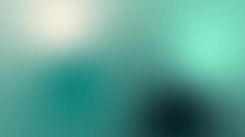 Vibrant green and blue light blend in a soft, blurry wave pattern, creating an abstract glow for a modern digital art background video