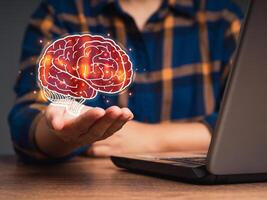 Brain symbol on the palm. Machine learning and artificial intelligence photo