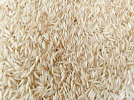 Uncooked natural Rice Top view texture background photo
