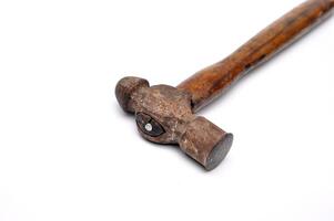 Old Ball Peen Hammer with Wooden Handle on White Background photo