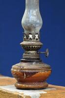 Vintage oil lamp with blurred background selective focus photo