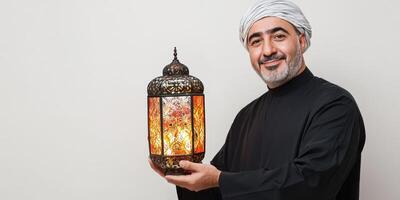 Arab man holding a lantern. photo
