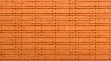 Uniform orange brick wall pattern texture background photo