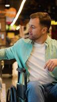 Customer in wheelchair choosing cheese at grocery store video