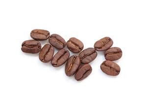 Brown coffee beans on white background photo