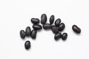 Black beans on white background photo