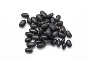 Black beans on white background, isolate of beans photo