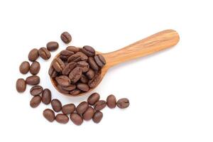 Coffee, coffee beans on a wooden spoon isolated on white background photo