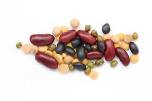 a variety of beans and legumes on a white background photo