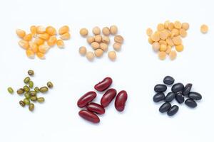 various types beans and beans on white background photo