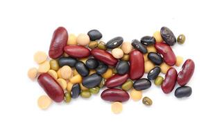 a pile of beans and beans on a white background photo