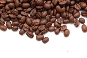 Brown coffee beans on white background, coffee background concept photo