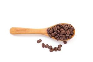 Coffee beans in spoon, Bean on white, brown coffee beans isolated on white background photo