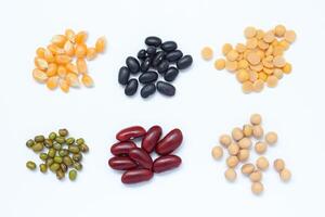 various types of beans and beans on white background photo